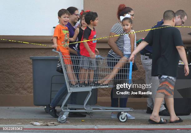 People stand in line at a Walmart store to purchase items after Hurricane Michael on October 16, 2018 in Panama City, Florida. Hurricane Michael...