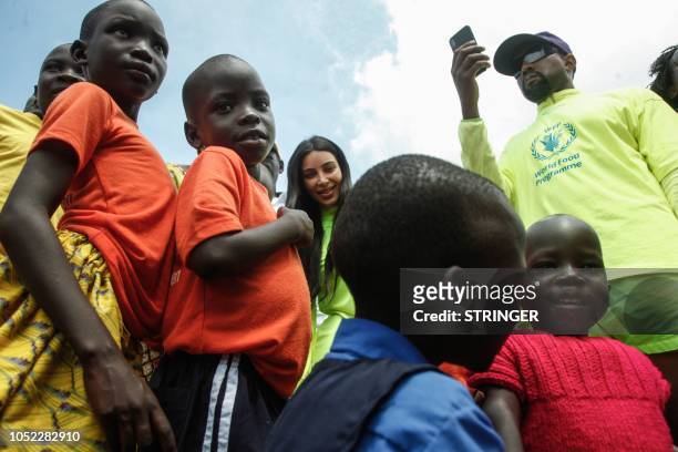 Rapper Kanye West and his wife Kim Kardashian visit an orphanage run by Uganda Womens Effort to Save Orphans in the town of Masulita, about 40...
