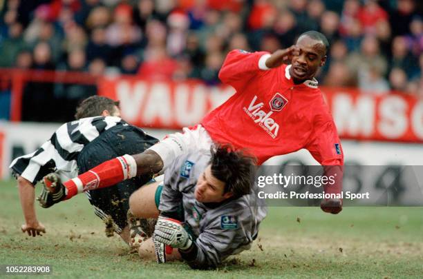 Rob Lee of Newcastle United collides with Charlton Athletic goalkeeper Andy Petterson and Richard Rufus during an FA Cup 3rd Round tie at The Valley...