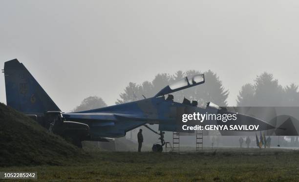 Picture taken on October 12, 2018 shows the Ukrainian Su-27 UB fighter at the Starokostyantyniv military airbase. - Ukraine's general staff said on...