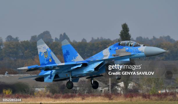 Picture taken on October 12, 2018 shows the Ukrainian Su-27 UB fighter flights during an air force exercises on Starokostyantyniv military airbase. -...