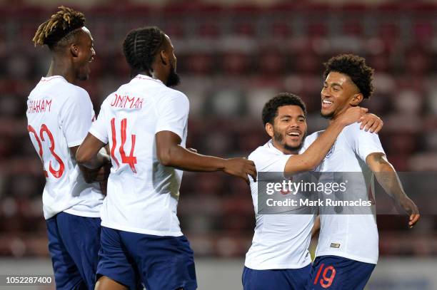 Reiss Nelson of England U21 celebrates with teammates after scoring his team's first goal during the 2019 UEFA European Under-21 Championship...