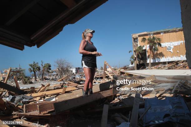 Chris McNeal looks over damge to her home which was destroyed by Hurricane Michael on October 16, 2018 in Mexico Beach, Florida. Hurricane Michael...