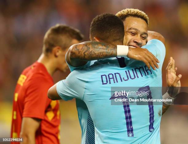 Arnaut Groeneveld of the Netherlands celebrates after scoring his team's first goal with teammate Memphis Depay who provided the assist during the...