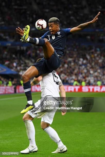 Niklas Suele of Germany collides with Presnel Kimpembe of France during the UEFA Nations League A group one match between France and Germany at Stade...