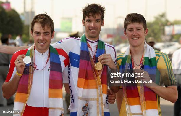 Alex Dowsett of England silver, David Millar of Scotland gold and Luke Durbridge of Australia bronze, celebrate with their medals after the Mens...