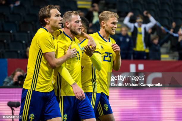 Sweden forward John Giudetti celebrates scoring the 1-0 goal with teammates Albin Ekdal, Sebastian Andersson, and Martin Olsson during the...