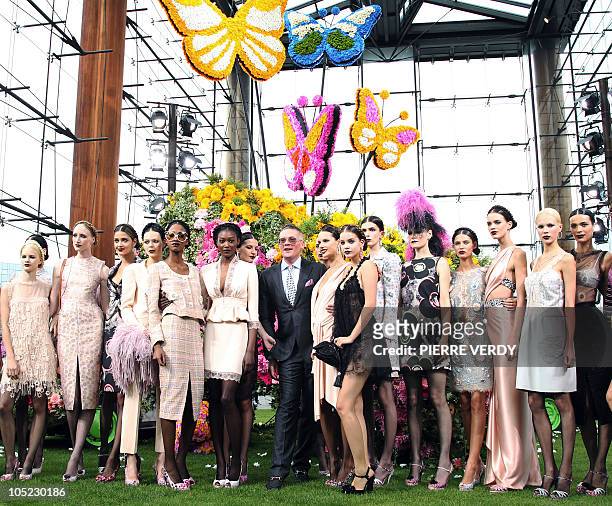 British designer Giles Deacon stands among models as he acknowledges the public after the Emmanuel Ungaro Spring/Summer 2011 ready-to-wear collection...