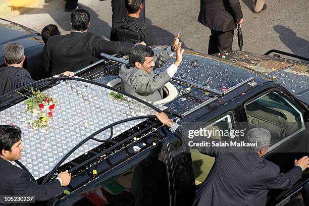 Iranian President Mahmoud Ahmadinejad waves to the crowd in southern suberb of Beirut upon his arrival on October 13, 2010 in Lebanon. The...