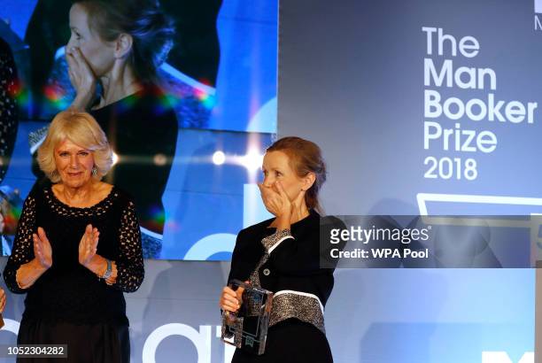 Camilla, Duchess of Cornwall presents writer Anna Burns with the Man Booker Prize for Fiction 2018 during the prize's 50th year, at the Guildhall on...