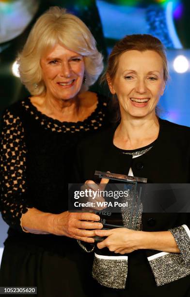 Camilla, Duchess of Cornwall presents writer Anna Burns with the Man Booker Prize for Fiction 2018 during the prize's 50th year, at the Guildhall on...