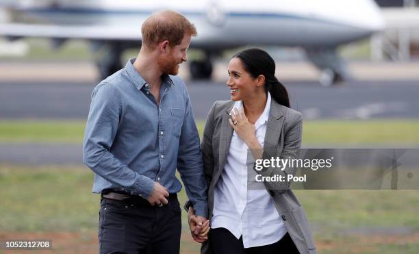 Prince Harry, Duke of Sussex and Meghan, Duchess of Sussex arrive at Dubbo Airport on October 17, 2018 in Dubbo, Australia. The Duke and Duchess of...