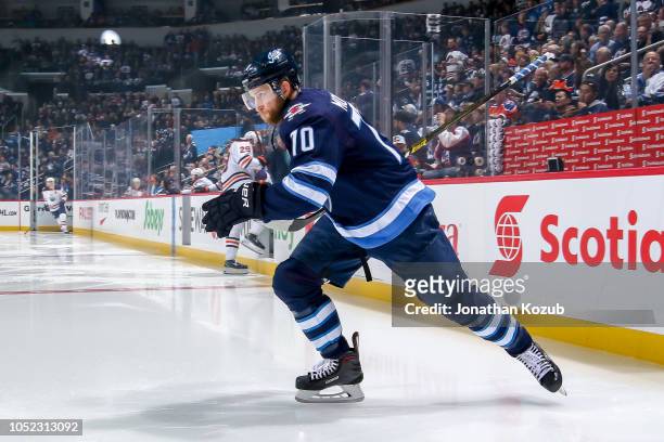Joe Morrow of the Winnipeg Jets hits the ice prior to puck drop against the Edmonton Oilers at the Bell MTS Place on October 16, 2018 in Winnipeg,...