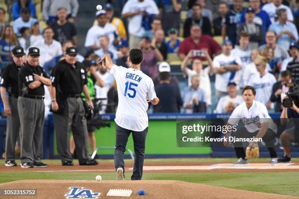 Former Los Angeles Dodgers Shawn Green throws out the first pitch to former Los Angeles Dodgers Eric Karros prior to Game Four of the National League...