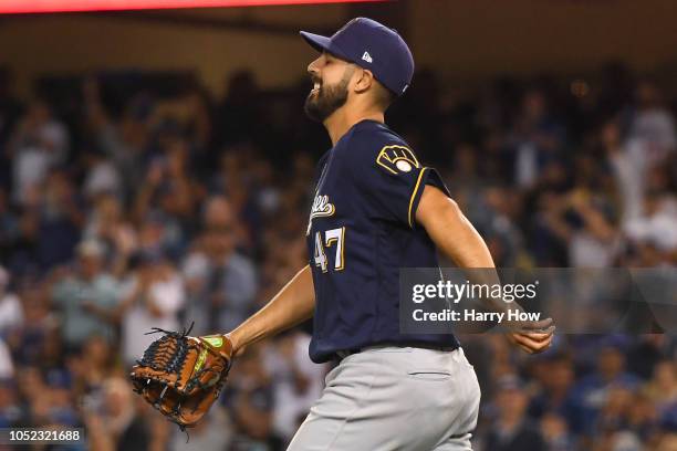 Gio Gonzalez of the Milwaukee Brewers reacts after making a play on a ball hit by Yasiel Puig of the Los Angeles Dodgers during the second inning in...