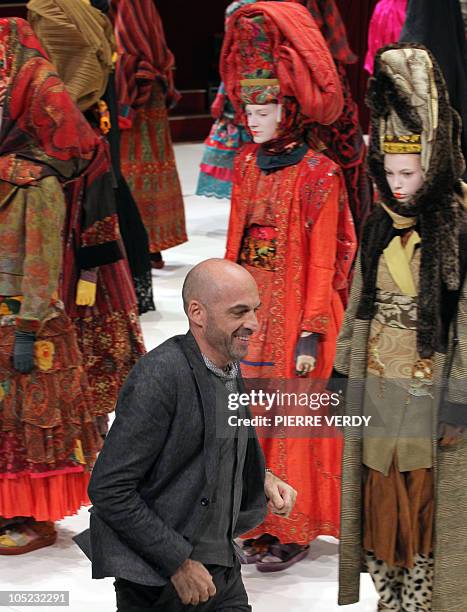 Italian designer Antonio Marras acknowledges the public after the Kenzo Spring/Summer 2011 ready-to-wear collection show on October 5, 2010 in Paris....