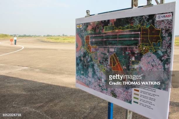 Vietnamese soldier stands guard near a map of the Bien Hoa air base, on the outskirts of Ho Chi Minh City, as US Defence Secretary Jim Mattis visits...