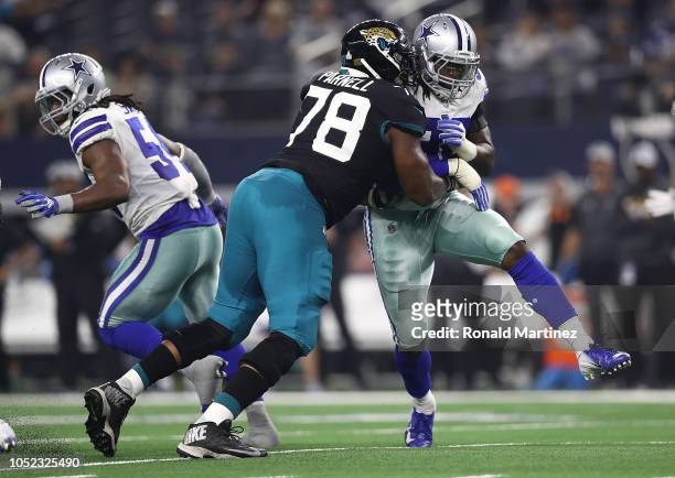 Demarcus Lawrence of the Dallas Cowboys and Jermey Parnell of the Jacksonville Jaguars at AT&T Stadium on October 14, 2018 in Arlington, Texas.