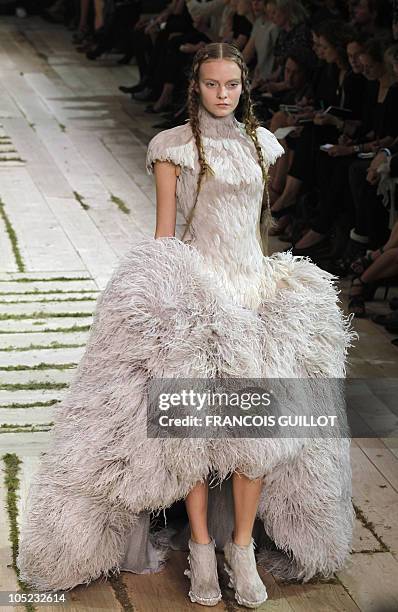 Model presents a creation by British designer Sarah Burton for Alexander McQueen during the Spring/Summer 2011 ready-to-wear collection show on...