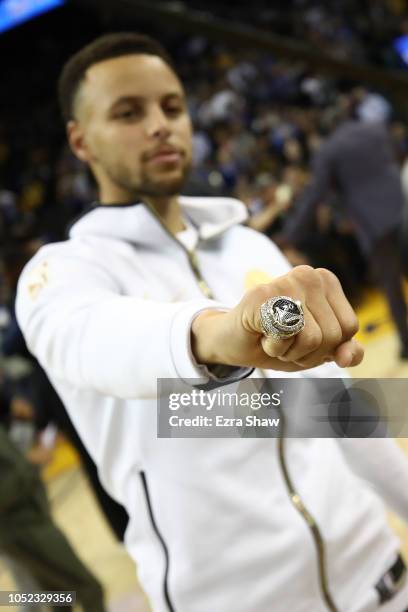 Stephen Curry of the Golden State Warriors shows his 2017-2018 Championship ring prior to their game against the Oklahoma City Thunder at ORACLE...