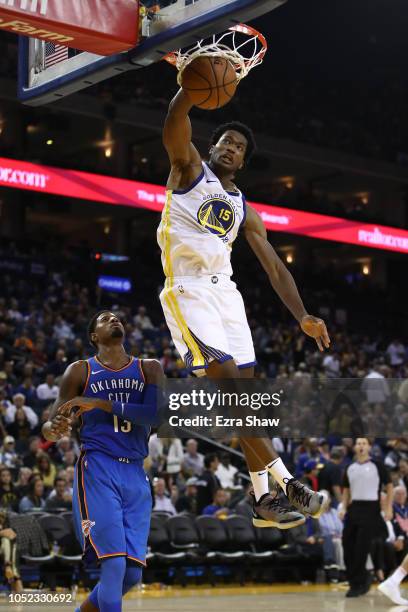 Damian Jones of the Golden State Warriors dunks the ball against the Oklahoma City Thunder during their NBA game at ORACLE Arena on October 16, 2018...