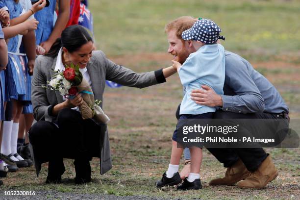 The Duke and Duchess of Sussex talk to Luke Vincent after arriving at Dubbo airport, in Australia, on the second day of their tour to the country.