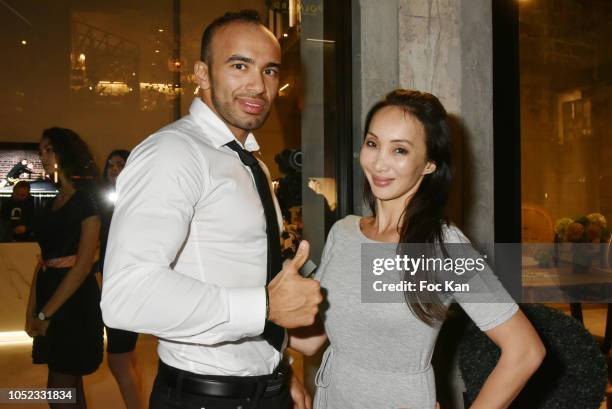 Karateka champion Djema Belkhodja and actress/blogger Celine Tran attends the 'Champion Spirit' Rive Gauche Launch Party at Beaupassage 14 Bd Raspail...