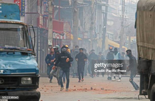 Kashmiri protesters clash with Indian paramilitary soldiers on the fourth and final phase of Urban Local Bodies election in Srinagar the summer...