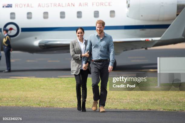 Prince Harry, Duke of Sussex and Meghan, Duchess of Sussex arrive at Dubbo Airport on October 17, 2018 in Dubbo, Australia. The Duke and Duchess of...