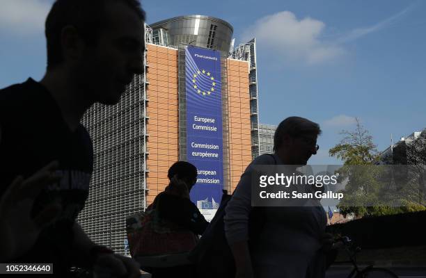 People walk past the Barleymont building of the European Commission on October 17, 2018 in Brussels, Belgium. British Prime Minister Theresa May is...