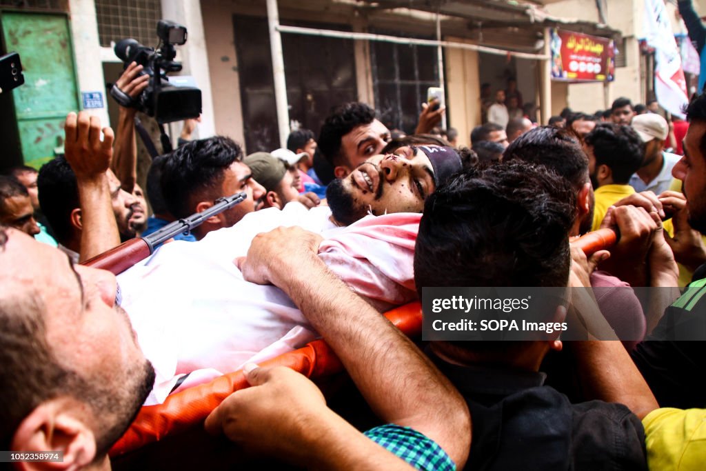 (EDITOR'S NOTE: IMAGE DEPICTS DEATH) Palestinians seen...