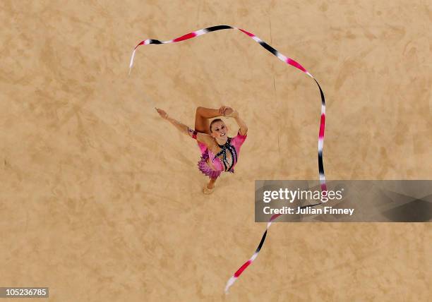 Francesca Fox of England performs with the ribbon as she competes in the in the All-Around Rhythmic Gymnastics Final at Indira Gandhi Sports Complex...