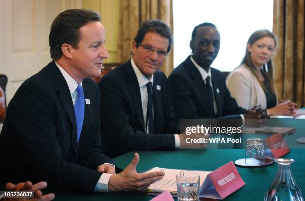 Prime Minister David Cameron and the current manager of the England national football team Fabio Capello speaks to the President of FIFA Sepp Blatter...