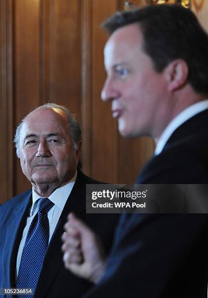 Prime Minister David Cameron speaks to the media as President of FIFA Sepp Blatter looks on at number 10 Downing Street on October 13, 2010 in...