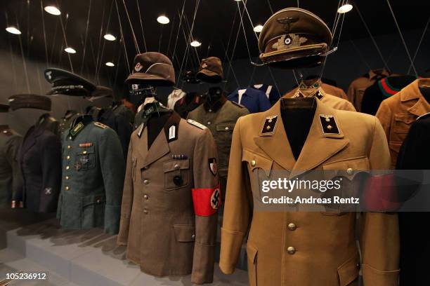 Uniforms of Nazi criminal Adolf Hitler and his regime are pictured during a press preview of 'Hitler and the Germans Nation and Crime' at Deutsches...