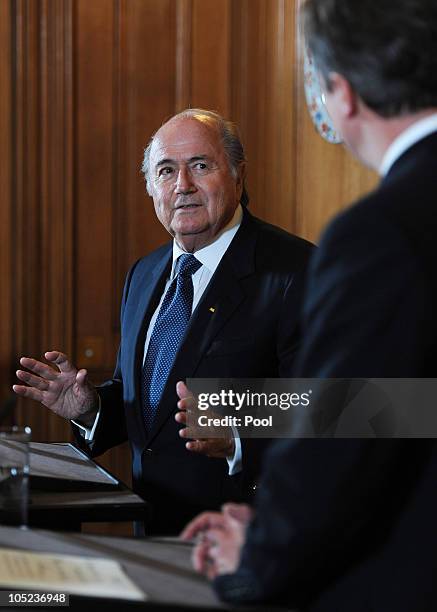 Prime Minister David Cameron looks on as President of FIFA Sepp Blatter speaks to the media at number 10 Downing Street on October 13, 2010 in...