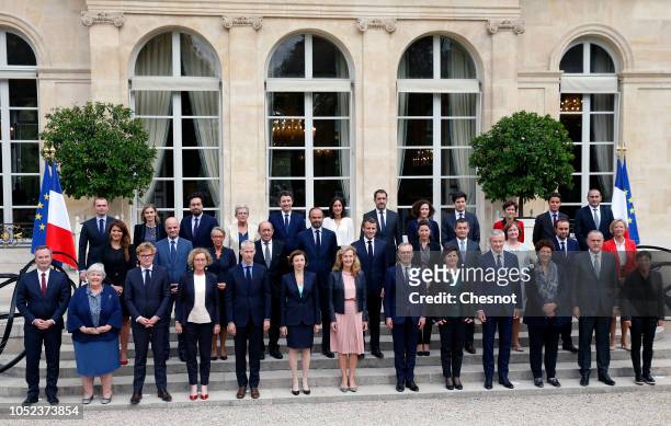 French President Emmanuel Macron poses for a photo with Prime Minister and his government following the weekly cabinet meeting on October 17, 2018 in...