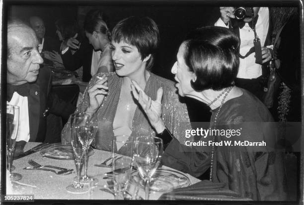 American film director Vincente Minnelli and his daughter, singer and actress Liza Minnelli listen to French-born American fashion editor Diana...