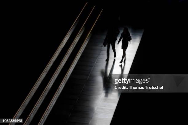 Silhouette of a man and a woman on October 17, 2018 in Berlin, Germany.