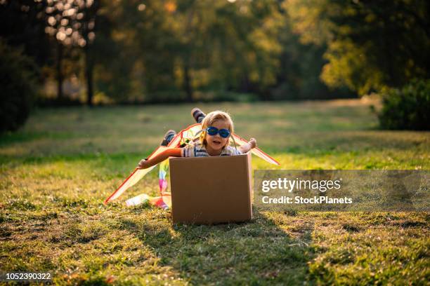 cute little boy imagine to fly - box kite stock pictures, royalty-free photos & images