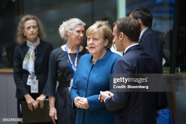 Angela Merkel, Germany's chancellor, left. Speaks with Emmanuel Macron, France's president, during a European Union leaders Brexit summit in...