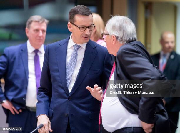 Polish Prime Minister Mateusz Morawiecki is talking with the President of the European Commission Jean-Claude Juncker at the start of an EU chief of...