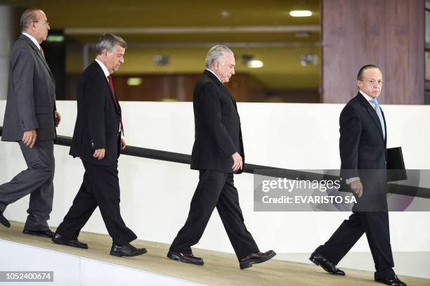 Brazilian President Michel Temer and advisors arrive for the "National Order of the Scientific Merit" award ceremony, at the Planalto Palace in...