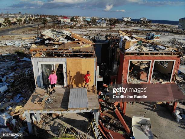 Bela and Jaques Sebastiao begin the process of cleaning up their home after after it was heavily damaged by Hurricane Michael, on October 17, 2018 in...