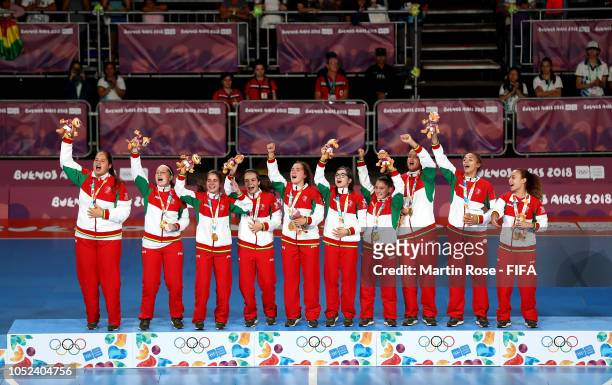 The tea, of Portugal celebrate winning the goal medal after the Women's Futsal Final match between Portugal and Japan during the Buenos Aires Youth...