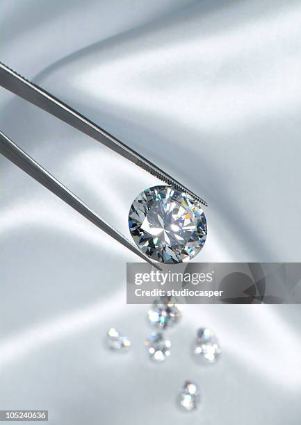 diamond jewelry holding - tweezers stock pictures, royalty-free photos & images