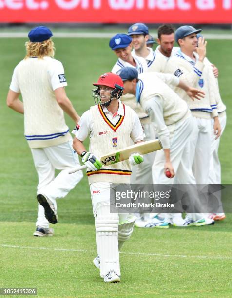 Jake Lehmann of the Redbacks leaves the ground after getting caught by Nick Larkin of the Blues during the Sheffield Shield match between South...