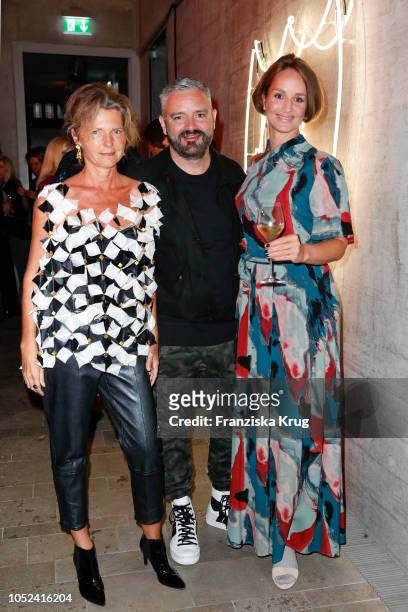Petra Wilma Mayer, fashion designer Adrian Runhof and Lara Joy Koerner attend the Dom Perignon 'The Legacy' on October 17, 2018 in Munich, Germany.