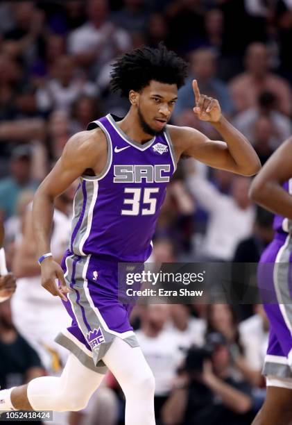 Marvin Bagley III of the Sacramento Kings reacts after he made his first NBA basket against the Utah Jazz at Golden 1 Center on October 17, 2018 in...