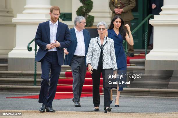 Prince Harry, Duke of Sussex and Meghan, Duchess of Sussex with Governor of Victoria Linda Dessau and her husband Anthony Howard at a reception given...